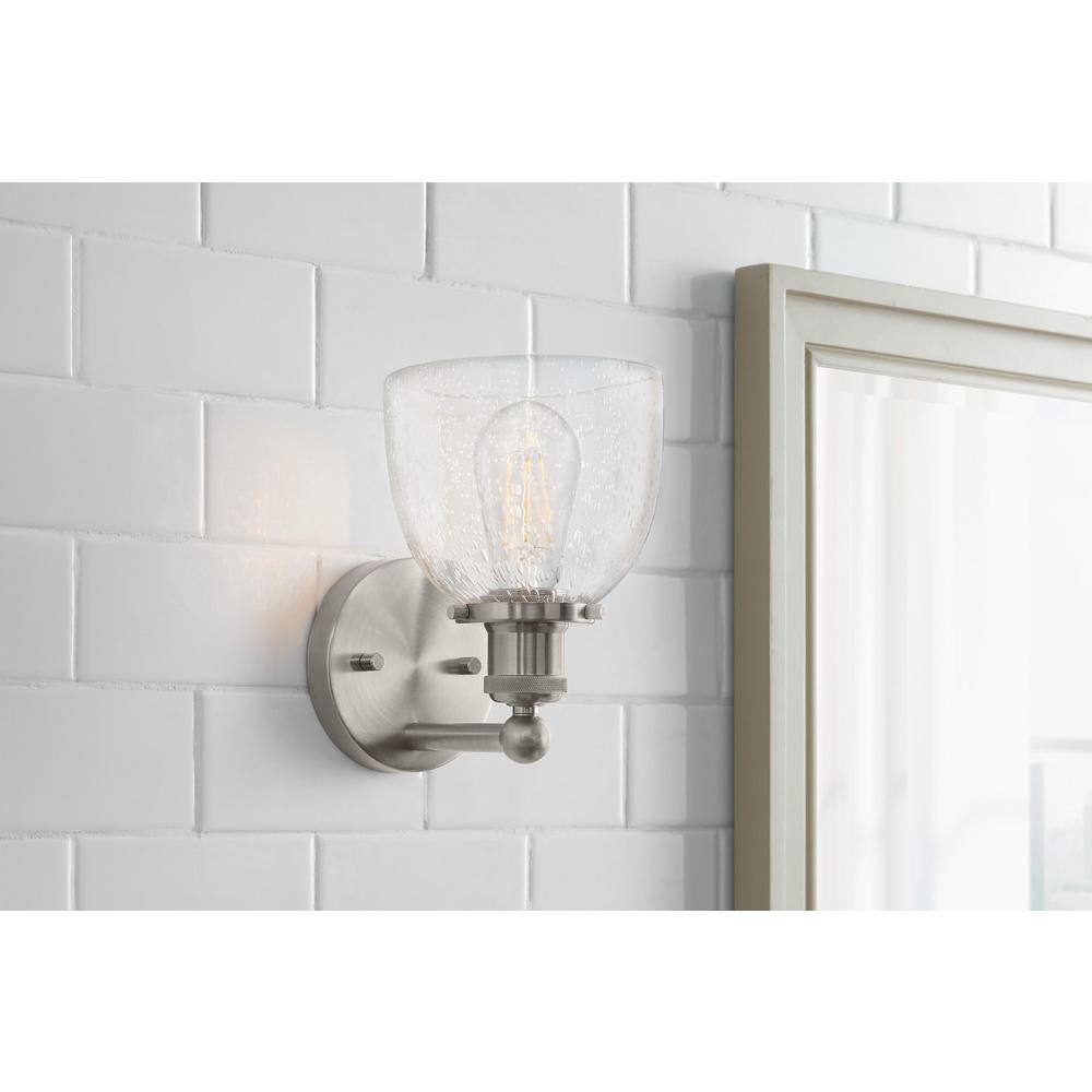 Home Decorators Collection Evelyn 6 in. 1-Light Brushed Nickel Modern Industrial Wall Mount Sconce Light with Clear Seeded Glass Shade