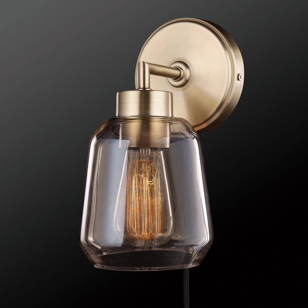 Globe Electric Salma 1-Light Matte Brass Plug-In or Hardwire Wall Sconce with Smoked Amber Glass Shade and In-Line On/Off Switch